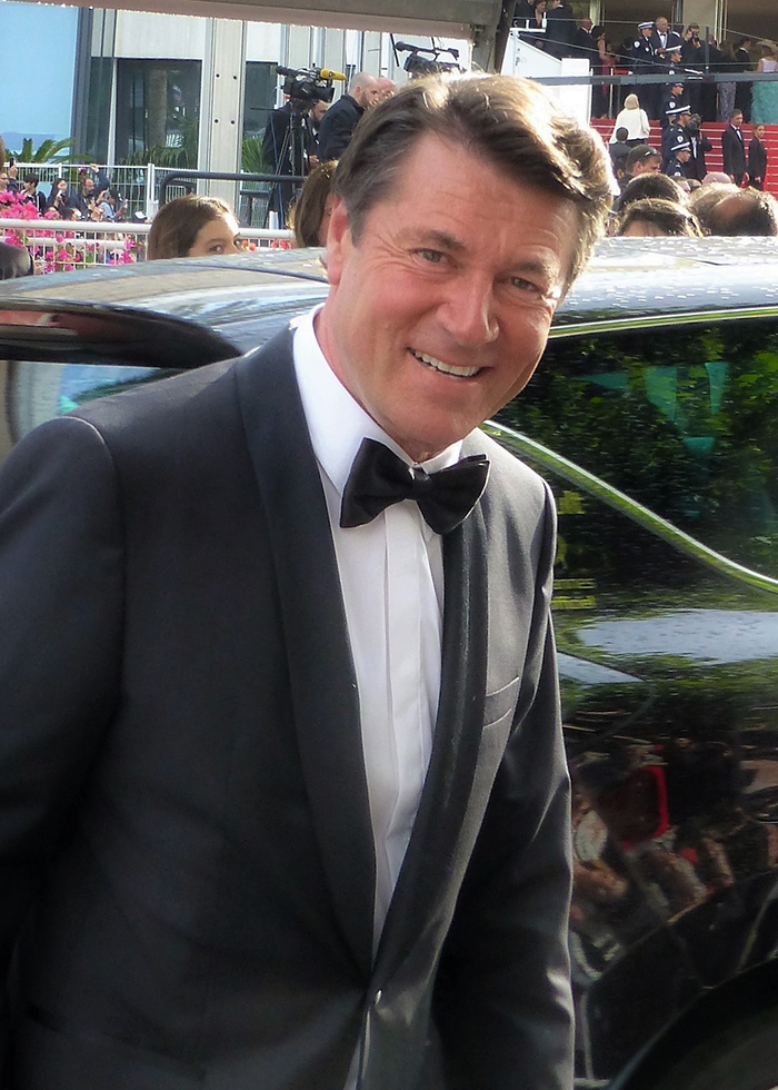 C. Estrosi, maire de Nice, s'apprêtant à monter les marches du festival de Cannes. Des projets plein la tête pour les studios de la Victorine. Photo (c) T. Gabbo (Flickr)